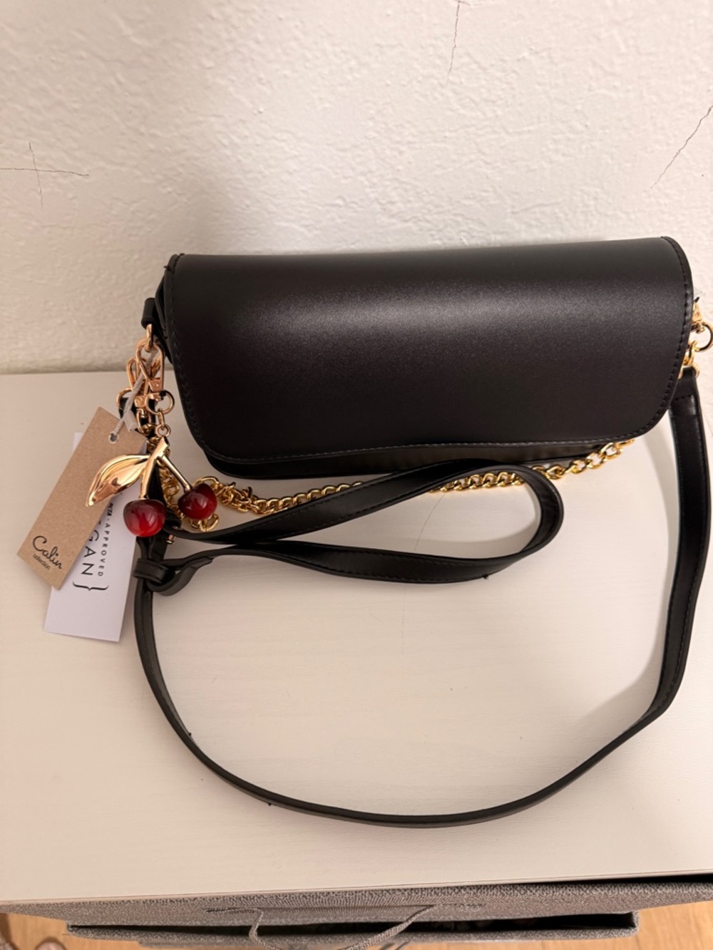 Chic Black Leather Crossbody with Gold Chain and Cherry Charm